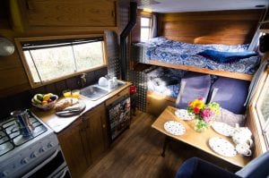 The inside of a handmade campervan available to rent from Quirky Campers