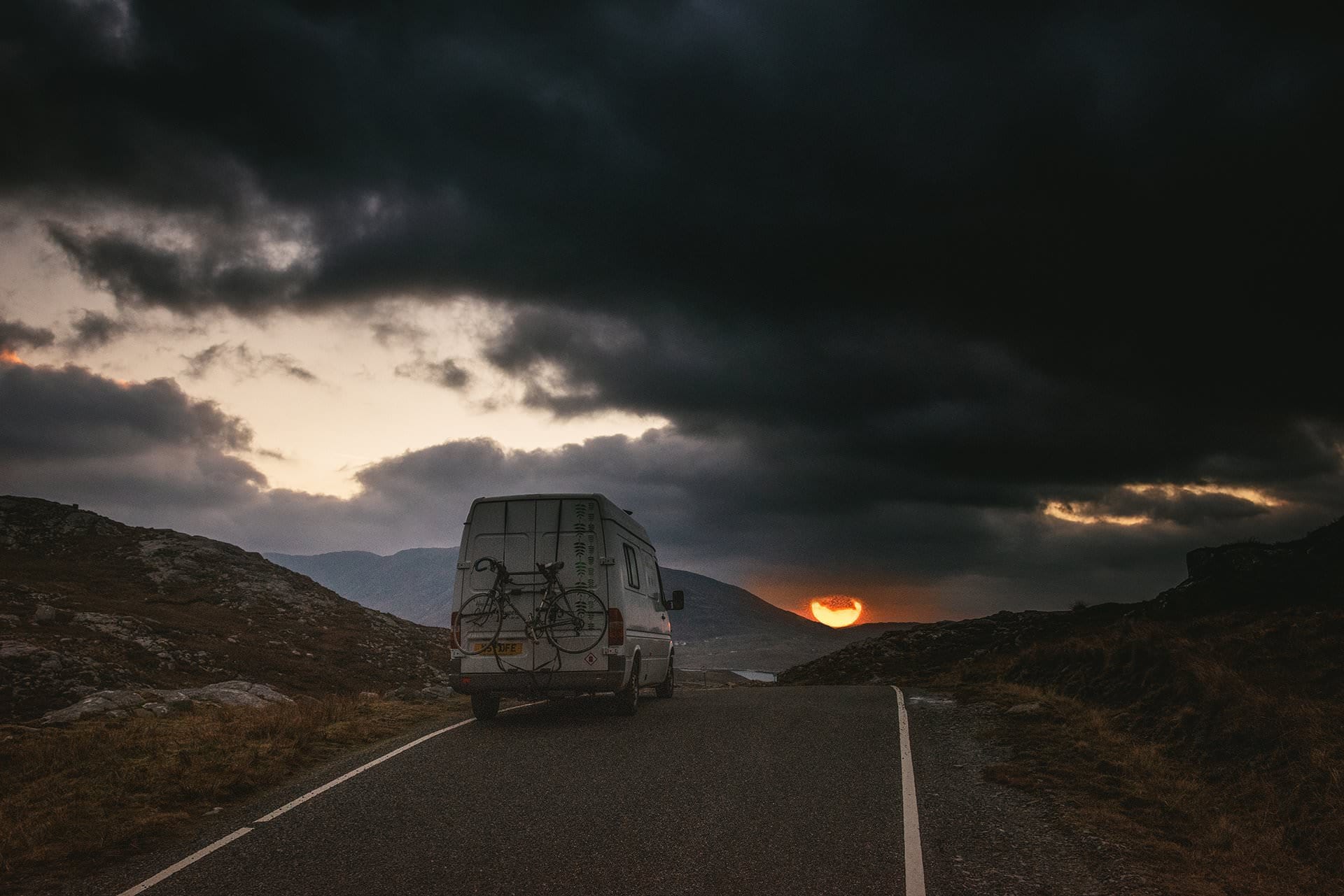 A Mercedes Sprinter on a sunset roadtrip in Ireland