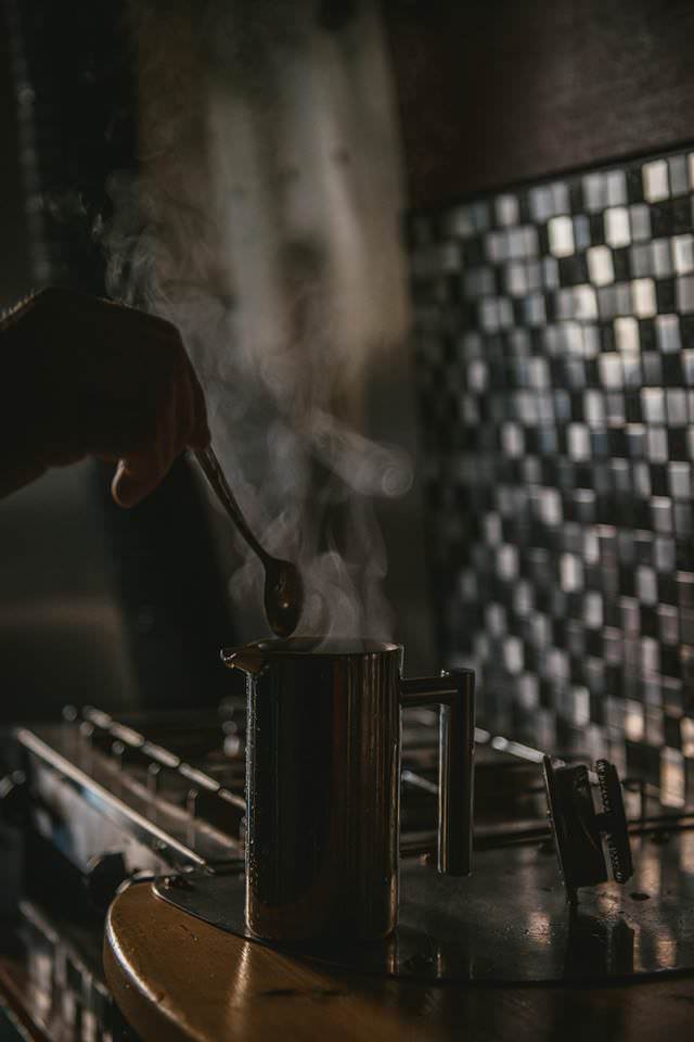 Steaming hot drink in a Mercedes Sprinter Campervan