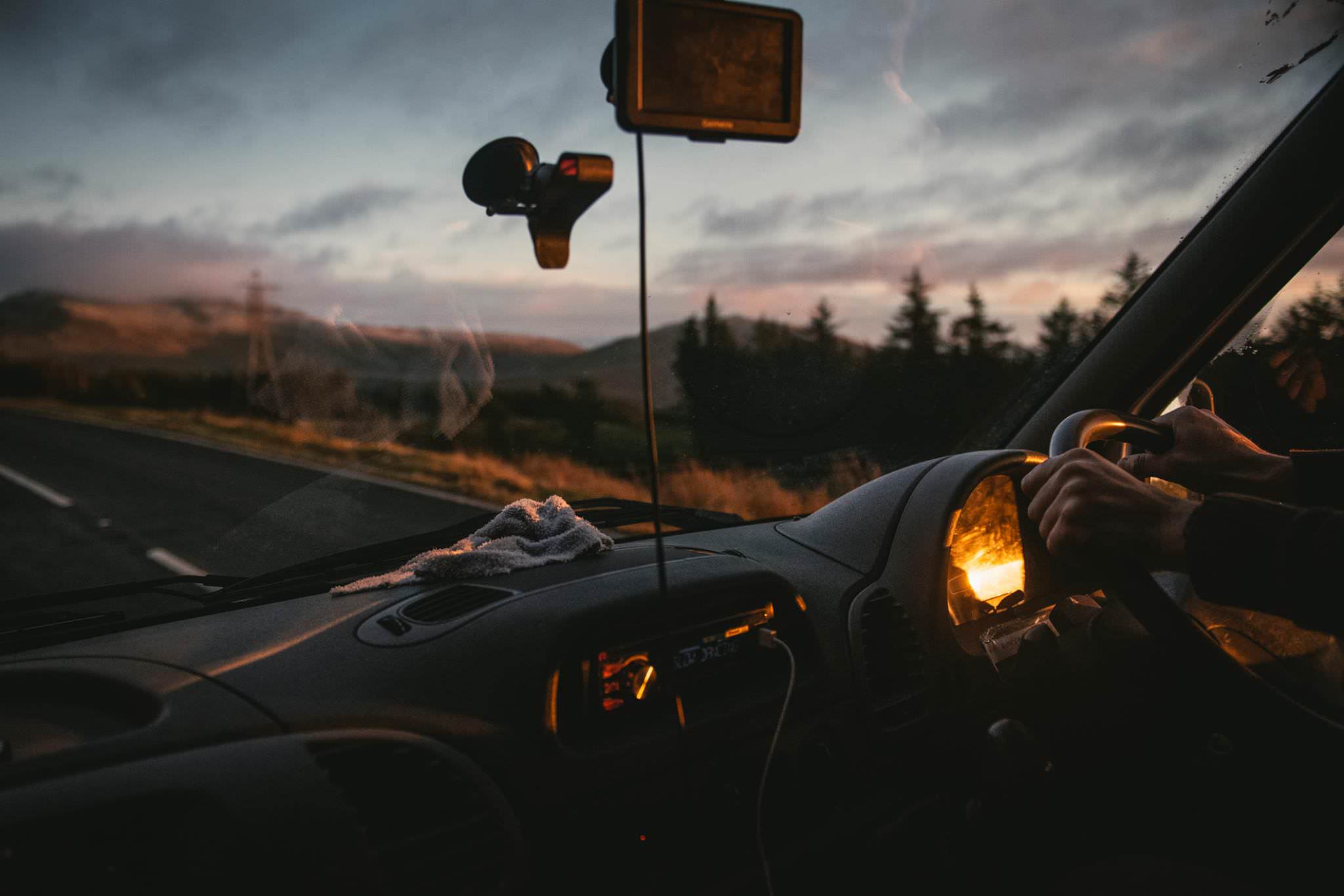 A campervan on a roadtrip in Ireland at sunset