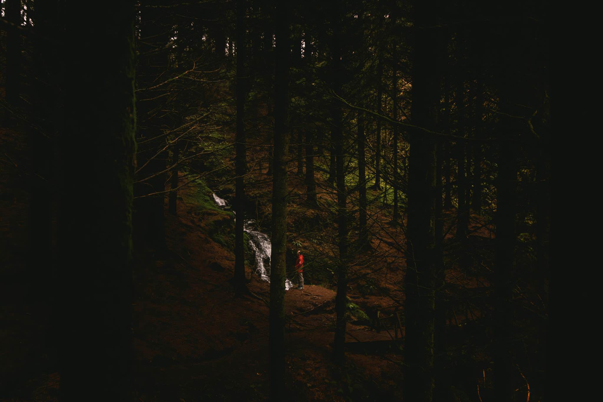 A man by a waterfall in Ireland