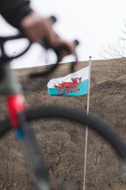 The Welsh flag in the background behind a bike