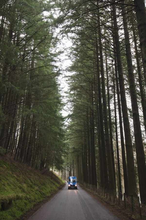 A campervan on a country road in Wales