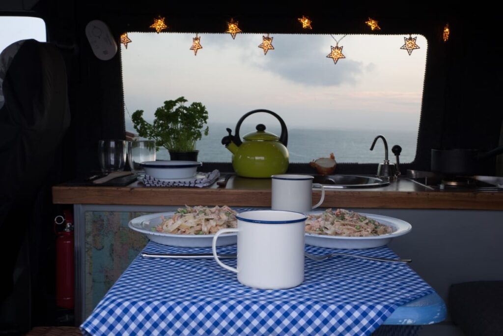 Salmon and pea pasta in Baxter the Quirky Camper. Hire him at https://www.quirkycampers.com/uk/campervans/devon/exeter-devon/baxter/