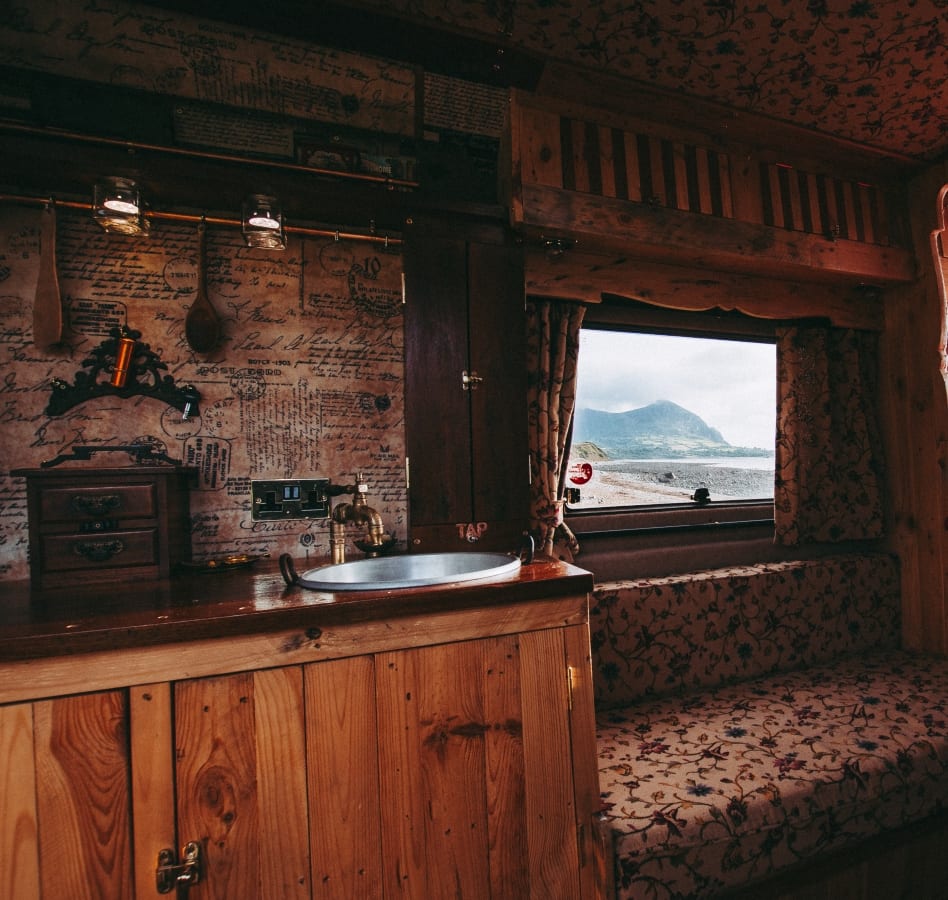 the kitchen area of a converted campervan