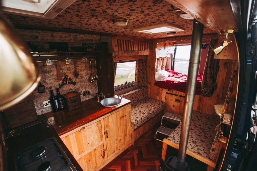 The final campervan conversion showing the bed, living and kitchen areas