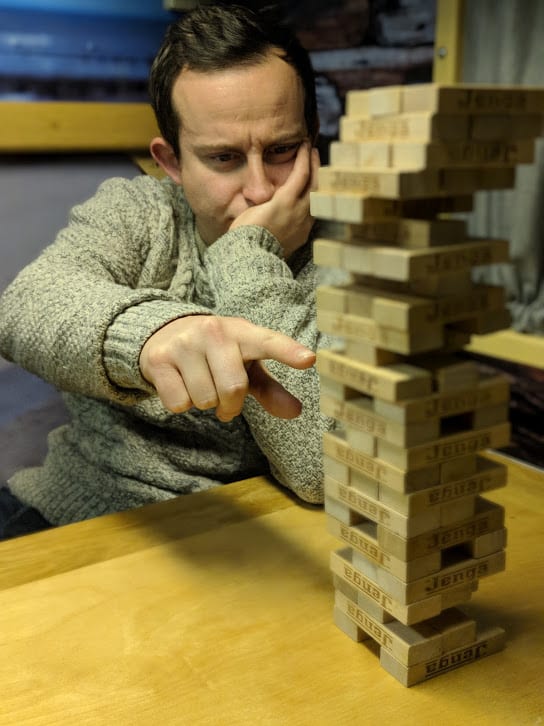 A man playing Jenga