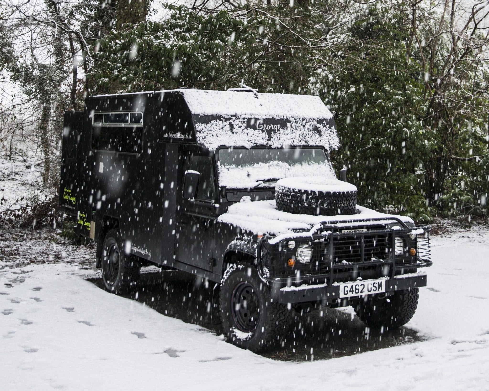 A campervan in the snow on an adventure holiday in UK