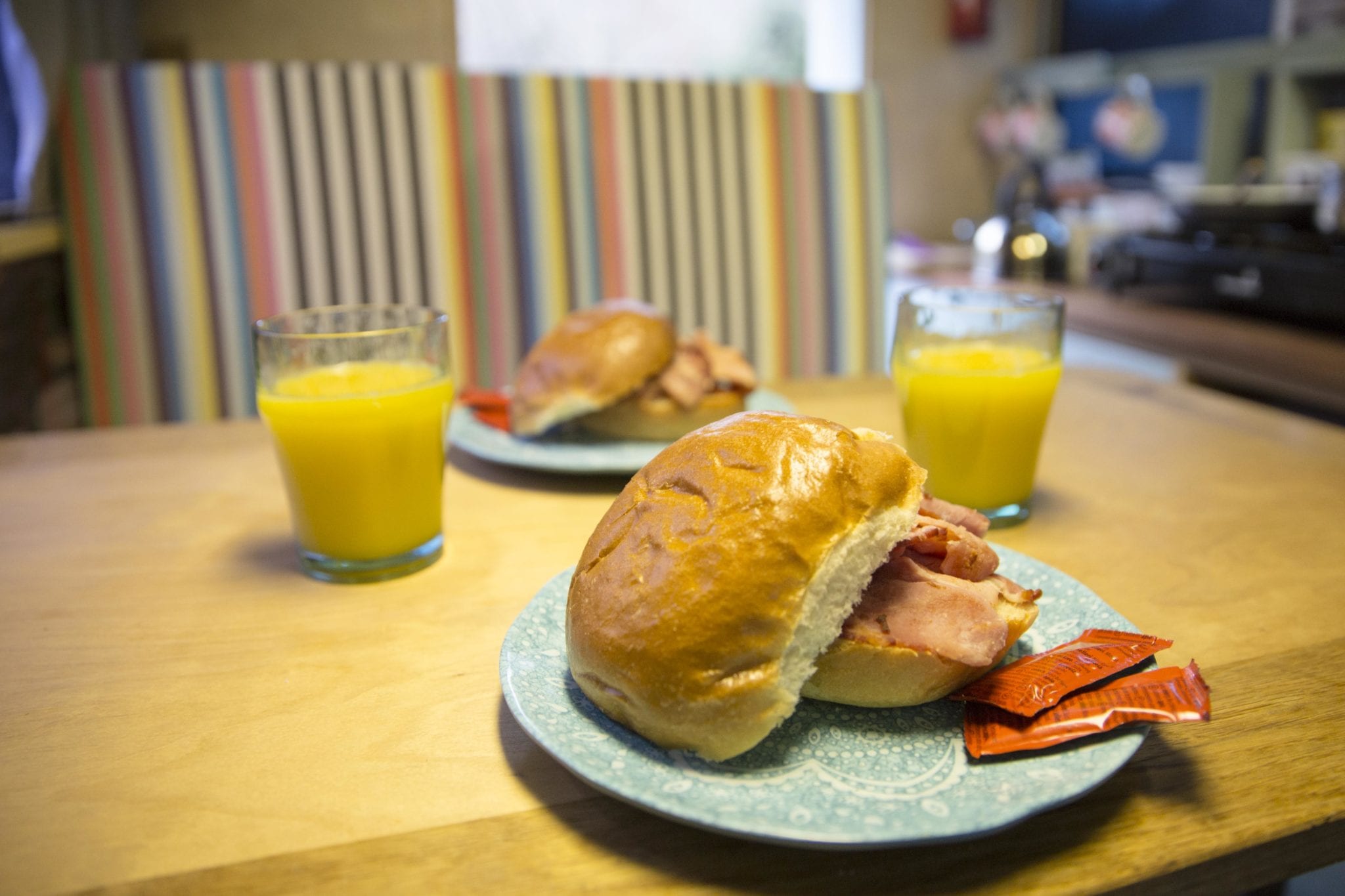 2 bacon bap and 2 glasses of orange juice