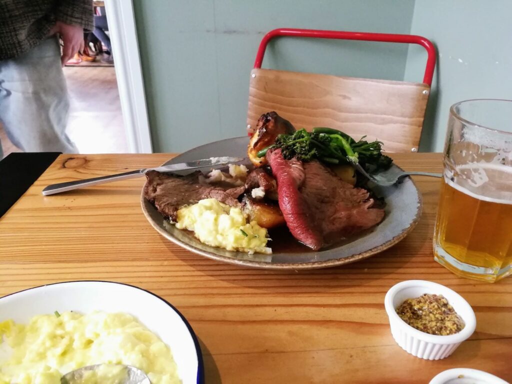 A sunday roast with pint of beer