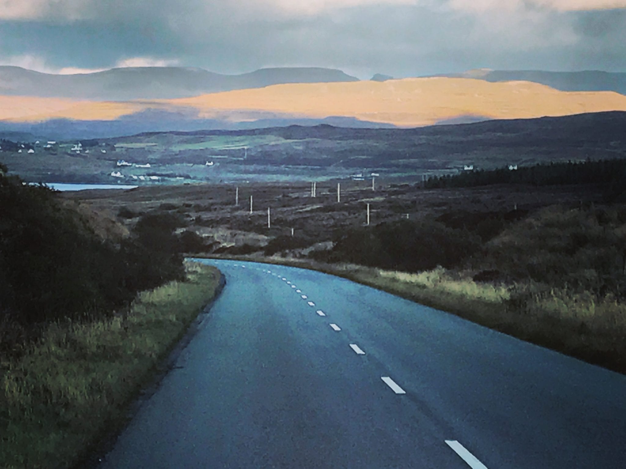 Moody sky on an empty windy road in Scotland