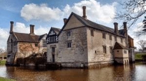 A National Trust house, Baddesley Clinton surrounded by a moat