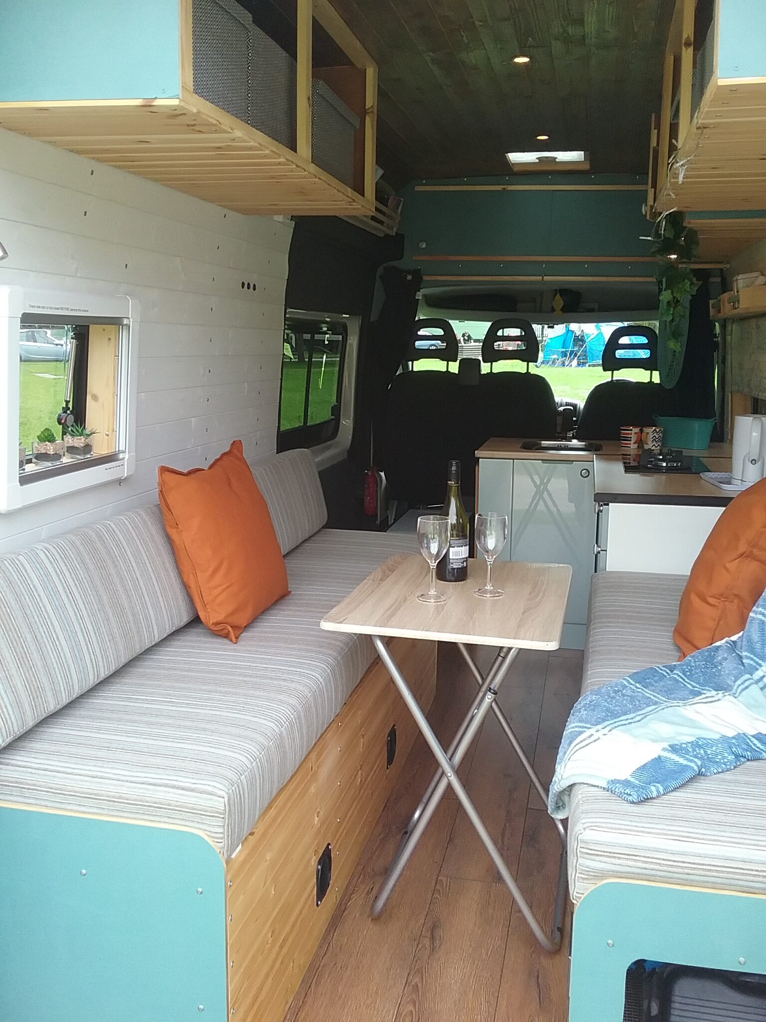 A table and chairs in a van.