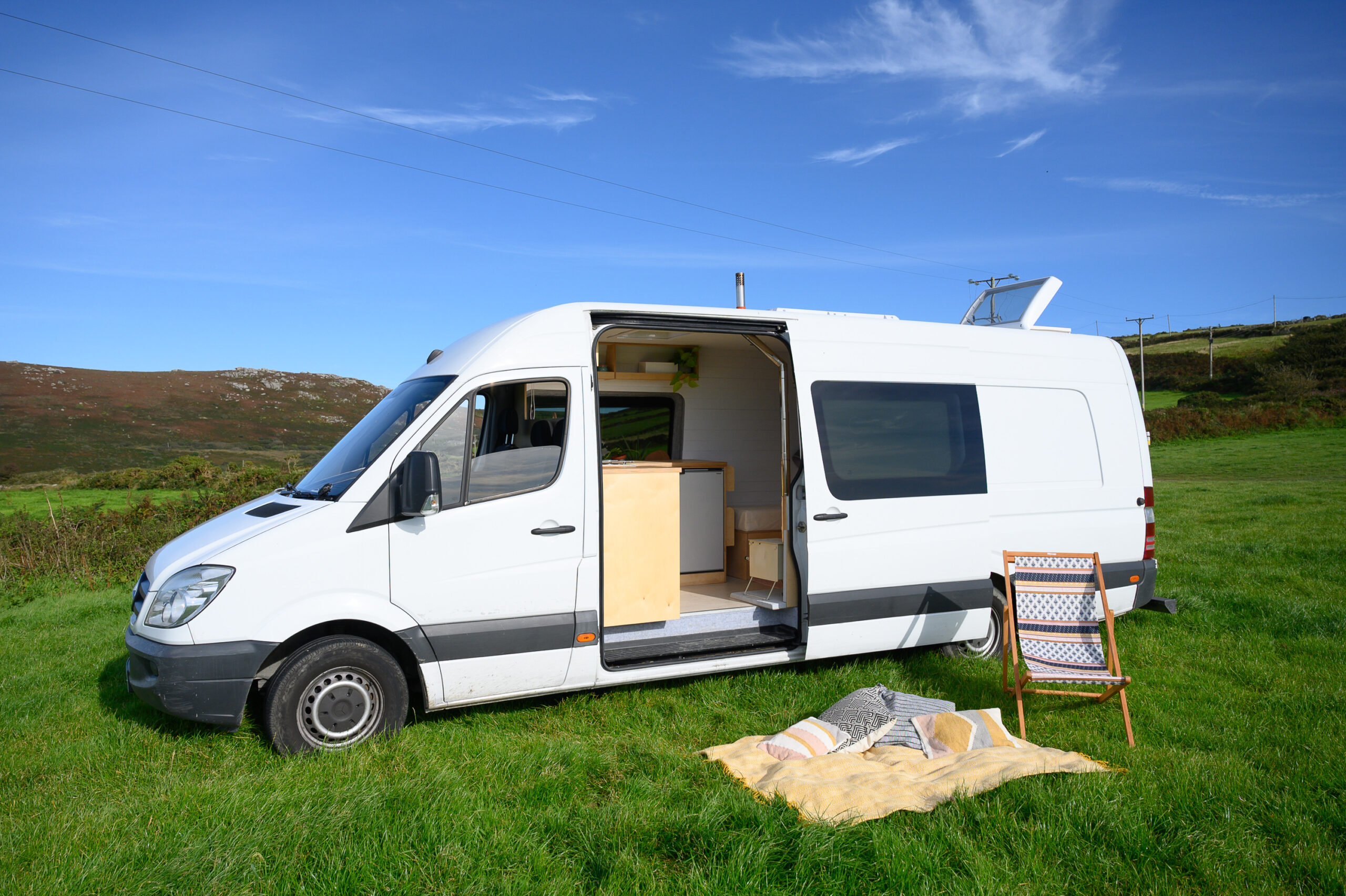 Scandi modern off-grid XLWB Sprinter with woodburner | Quirky Campers