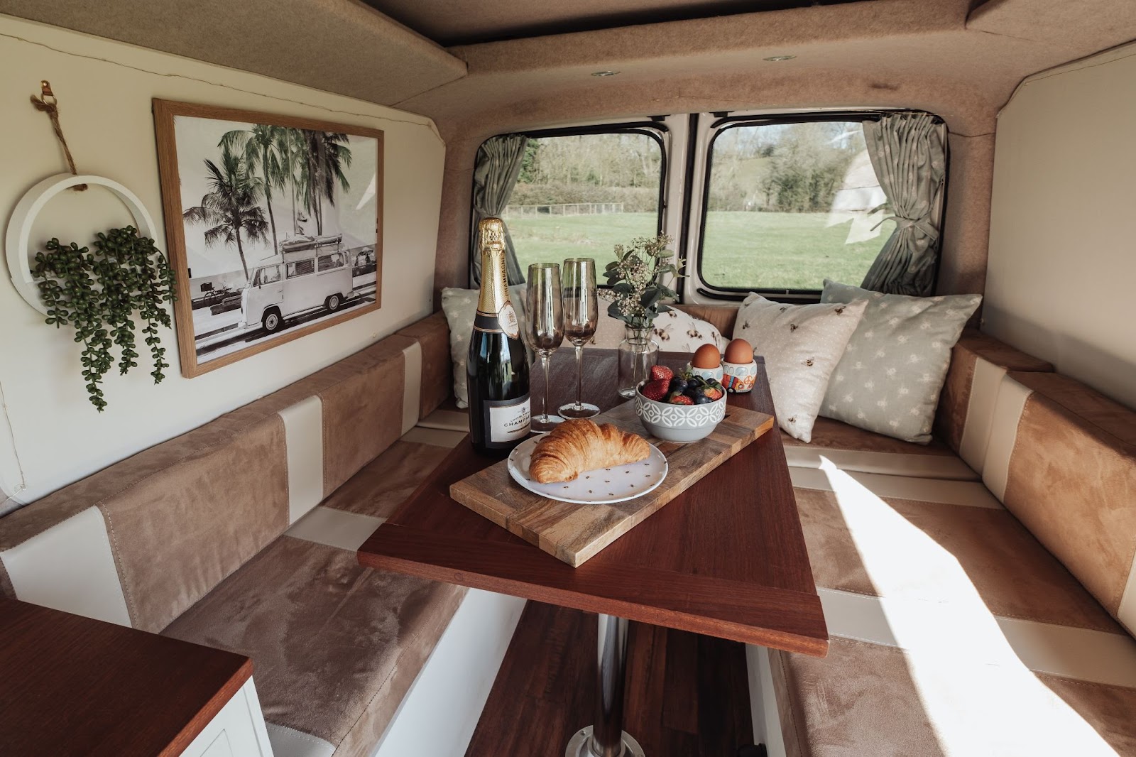 Modern, campervan set up with champagne breakfast. 