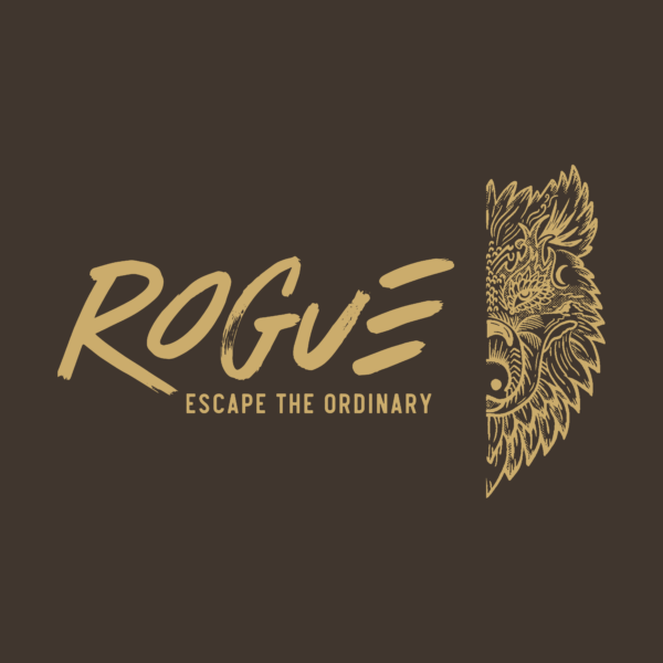 A logo on a dark background with the text "ROGUE" in large, bold, stylized letters above the tagline "ESCAPE THE ORDINARY." To the right of the text, there is an intricate, detailed golden wolf's head illustration, with only the left half visible, blending into the background.